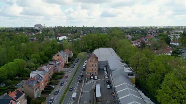 Aerial view of industrial and residential buildings with green trees Belgium. Aerial view of industrial and residential buildings with green trees Belgium.