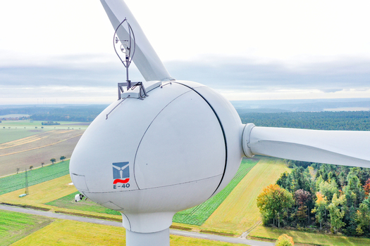 Simmerath Germany 09 May 2026 Aerial view of the nacelle of an Enercon E 40 wind turbine with an anemometer on top overlooking green agricultural fields and autumn forests. Simmerath Germany 09 May 2026 Aerial view of the nacelle of an Enercon E 40 wind turbine with an anemometer on top overlooking green agricultural fields and autumn forests.