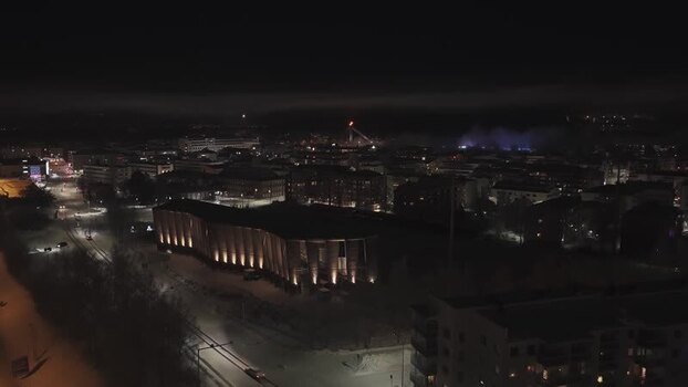 Aerial view of the illuminated Arktikum museum at night Finland.
