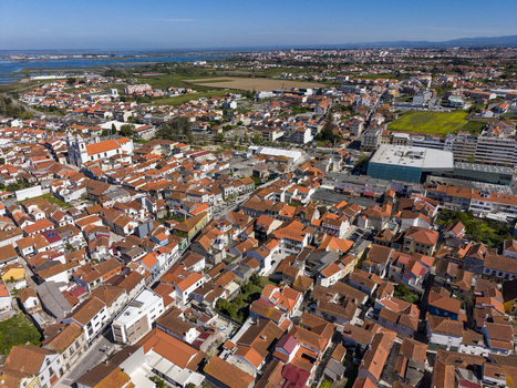 Aerial view of the town with its terracotta rooftops contrasting against the bright blue sky Vila do Conde Portugal. Aerial view of the town with its terracotta rooftops contrasting against the bright blue sky Vila do Conde Portugal.