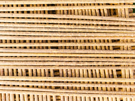 Aerial view of a stack of wooden poles arranged in a grid pattern in Brankas Jelgava Municipality Latvia. Aerial view of a stack of wooden poles arranged in a grid pattern in Brankas Jelgava Municipality Latvia.
