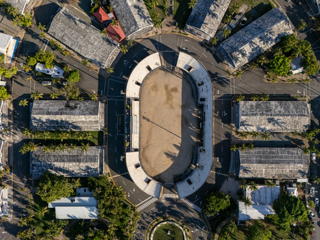 Aerial view of Feria Ganadera featuring an oval arena surrounded by urban streets palm trees and historic buildings located in Santo Domingo Distrito Nacional Dominican Republic. Aerial view of Feria Ganadera featuring an oval arena surrounded by urban streets palm trees and historic buildings located in Santo Domingo Distrito Nacional Dominican Republic.