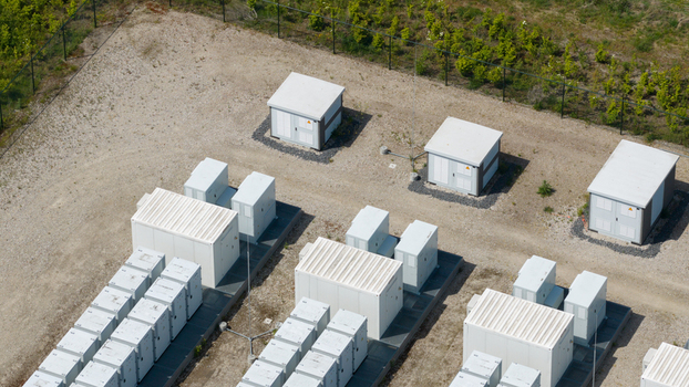 Wanneperveen Netherlands 23 May 2026 Aerial view of a battery energy storage system with rows of white utility containers and electrical cabinets on a gravel lot. Wanneperveen Netherlands 23 May 2026 Aerial view of a battery energy storage system with rows of white utility containers and electrical cabinets on a gravel lot.