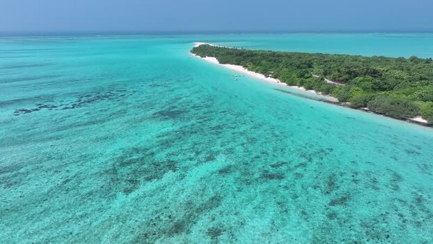 Aerial view of the tropical island of Bileffahi with turquoise waters Maldives. Aerial view of the tropical island of Bileffahi with turquoise waters Maldives.