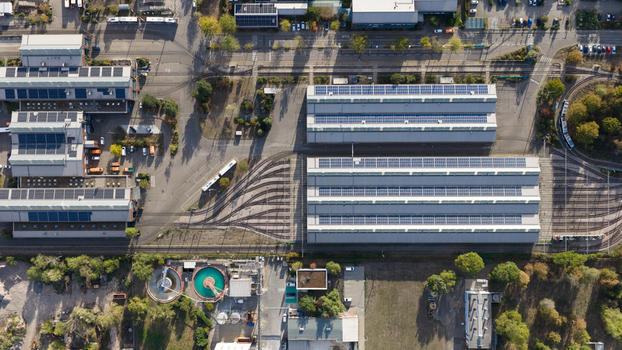 Aerial view of the Rhein Neckar Verkehr GmbH depot with industrial buildings solar panels and tram tracks in Ludwigshafen am Rhein Rheinland Pfalz Germany. Aerial view of the Rhein Neckar Verkehr GmbH depot with industrial buildings solar panels and tram tracks in Ludwigshafen am Rhein Rheinland Pfalz Germany.