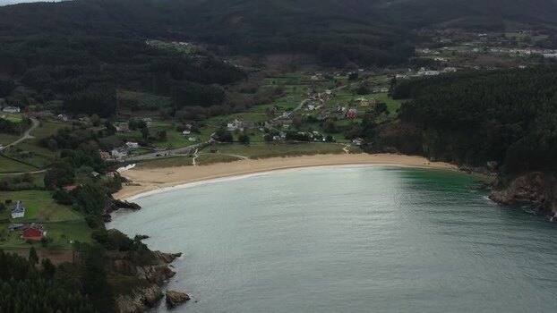 Aerial view of Xillloi Beach and the coastal landscape in Spain. Aerial view of Xillloi Beach and the coastal landscape in Spain.