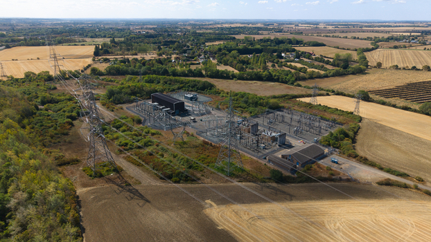 Aerial view of Eaton Socon Substation surrounded by agricultural fields high voltage power lines and rural landscape in St. Neots England United Kingdom. Aerial view of Eaton Socon Substation surrounded by agricultural fields high voltage power lines and rural landscape in St. Neots England United Kingdom.