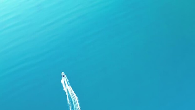 Aerial view of boat in turquoise water Norway.
