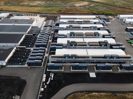 Aerial view of a large data center facility with rows of server containers and industrial infrastructure in Keflavik Reykjanesbaer Iceland. Aerial view of a large data center facility with rows of server containers and industrial infrastructure in Keflavik Reykjanesbaer Iceland.