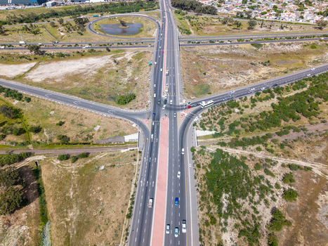 Aerial view of the Milnerton highway interchange with multi lane roads traffic and surrounding dry landscape in Cape Town Western Cape South Africa. Aerial view of the Milnerton highway interchange with multi lane roads traffic and surrounding dry landscape in Cape Town Western Cape South Africa.
