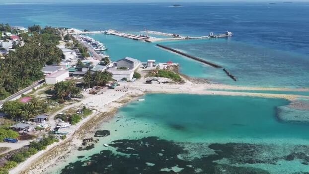 Aerial view of the harbor and tropical coastline Maldives. Aerial view of the harbor and tropical coastline Maldives.