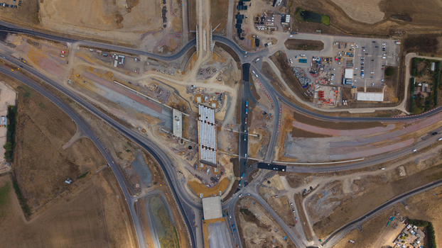 Aerial view of the Black Cat Roundabout highway construction project showing ongoing civil engineering work heavy machinery and new road infrastructure in Chawston England United Kingdom. Aerial view of the Black Cat Roundabout highway construction project showing ongoing civil engineering work heavy machinery and new road infrastructure in Chawston England United Kingdom.