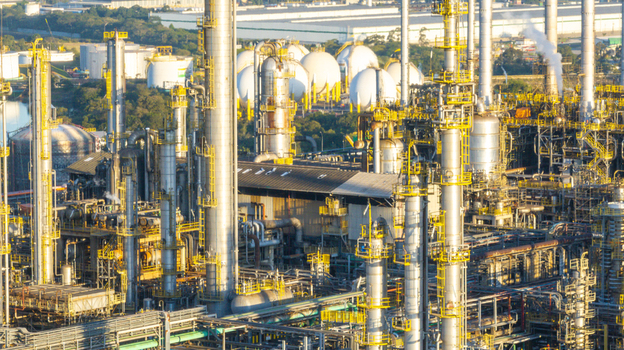 Aerial view of the petrochemical complex in Santo Andre featuring industrial towers spherical storage tanks and piping systems. Santo Andre State of Sao Paulo Brazil.