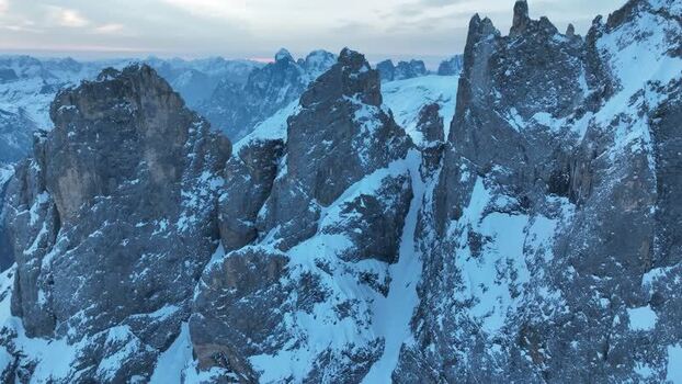 Aerial view of Pale di San Martino peaks in winter Italy.
