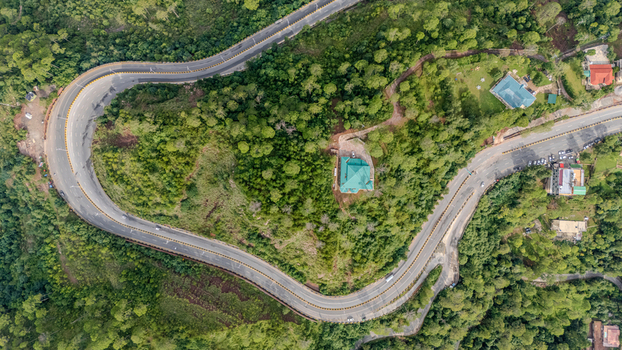 Aerial view of the Islamabad Murree Expressway winding through the lush green forests and hilly landscape of Lower Topa Punjab Pakistan. Aerial view of the Islamabad Murree Expressway winding through the lush green forests and hilly landscape of Lower Topa Punjab Pakistan.