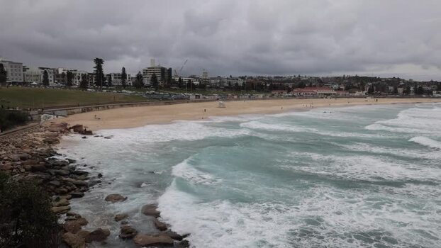 View of Bondi Beach with crashing waves in Sydney Australia.