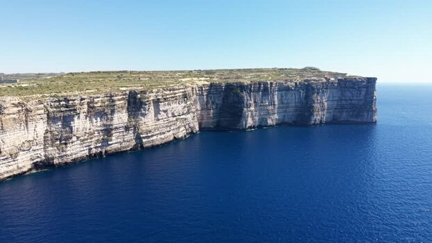 Aerial view of the rugged limestone cliffs of Dwejra Bay Malta. Aerial view of the rugged limestone cliffs of Dwejra Bay Malta.