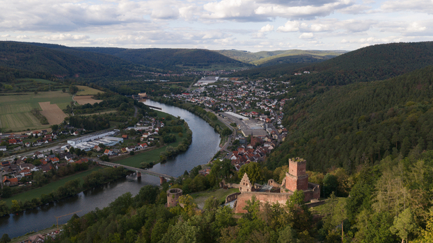 Aerial view of the historic Burg Freudenburg ruins overlooking the winding Main river and the town of Freudenberg Baden Wurttemberg Germany.