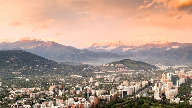 Aerial view of the city of Santiago with its modern skyline and residential areas nestled against the backdrop of the Andes mountains at sunset in Santiago Santiago Metropolitan Chile. Aerial view of the city of Santiago with its modern skyline and residential areas nestled against the backdrop of the Andes mountains at sunset in Santiago Santiago Metropolitan Chile.