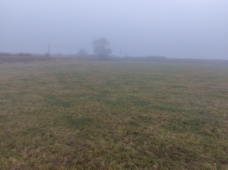 Aerial view of misty rural farmland with low visibility and foggy atmosphere in the countryside Looe Cornwall United Kingdom. Aerial view of misty rural farmland with low visibility and foggy atmosphere in the countryside Looe Cornwall United Kingdom.