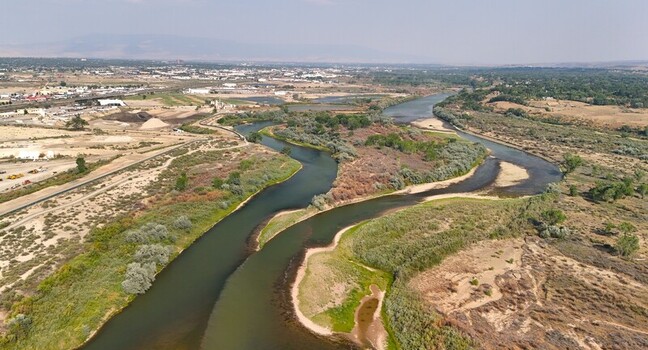 Aerial view of the Colorado River showing low water levels and smokey haze during a severe drought near Grand Junction Colorado United States. Aerial view of the Colorado River showing low water levels and smokey haze during a severe drought near Grand Junction Colorado United States.