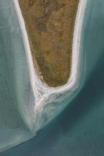 Aerial view of the Lofoten coastal spit with sandy shores and turquoise waters in Svolvaer Nordland Norway.