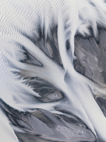 Aerial view of glacial rivers carving intricate patterns across the landscape a dance of icy whites and stony greys Lake Tekapo New Zealand. Aerial view of glacial rivers carving intricate patterns across the landscape a dance of icy whites and stony greys Lake Tekapo New Zealand.