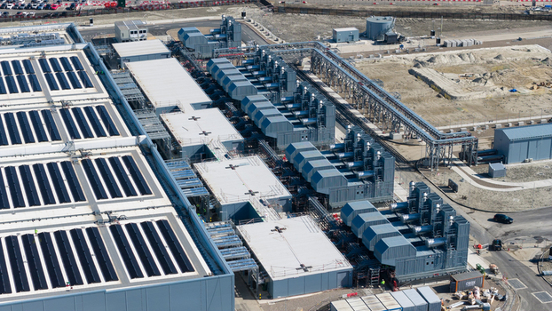 Aerial view of the industrial facility at Westpoort featuring solar panels on the roof and large cooling units in Groningen Groningen Netherlands.