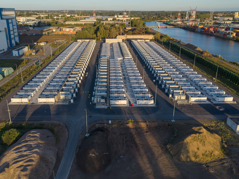 Aerial view of the Cargovil battery energy storage system featuring rows of white energy storage containers industrial infrastructure and nearby canal in Vilvoorde Vlaanderen Belgium. Aerial view of the Cargovil battery energy storage system featuring rows of white energy storage containers industrial infrastructure and nearby canal in Vilvoorde Vlaanderen Belgium.