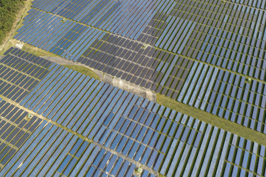 Aerial view of the former Military Airfield Preschen now a solar field with rows of photovoltaic panels covering the historic runway and taxiway Neisse Malxetal Brandenburg Germany. Aerial view of the former Military Airfield Preschen now a solar field with rows of photovoltaic panels covering the historic runway and taxiway Neisse Malxetal Brandenburg Germany.