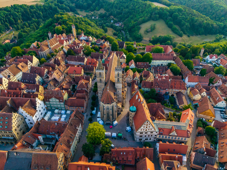 Aerial view of the historic town of Rothenburg ob der Tauber featuring St. Jakob s Church red tiled rooftops and narrow streets in Rothenburg ob der Tauber Bavaria Germany. Aerial view of the historic town of Rothenburg ob der Tauber featuring St. Jakob s Church red tiled rooftops and narrow streets in Rothenburg ob der Tauber Bavaria Germany.
