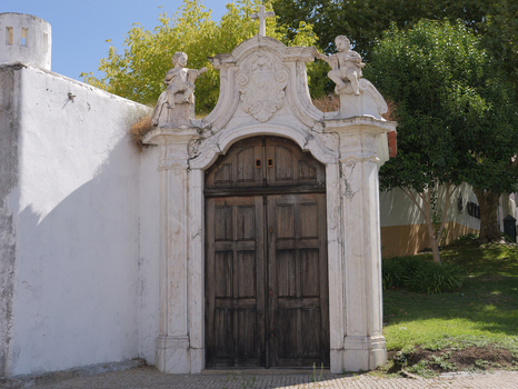 View of the ornate stone doorway of the Saint Bernard Convent in Portalegre featuring carved figures and a wooden door Portalegre Portalegre District Portugal. View of the ornate stone doorway of the Saint Bernard Convent in Portalegre featuring carved figures and a wooden door Portalegre Portalegre District Portugal.