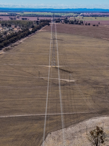Aerial view of high voltage power lines stretching across vast agricultural fields near the Millmerran Power Station in Domville Queensland Australia. Aerial view of high voltage power lines stretching across vast agricultural fields near the Millmerran Power Station in Domville Queensland Australia.