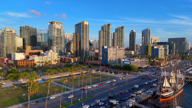 Aerial view of North Harbor Drive and North Embarcadero with the San Diego skyline palm trees and the historic Star of India ship docked at the waterfront in San Diego California United States.