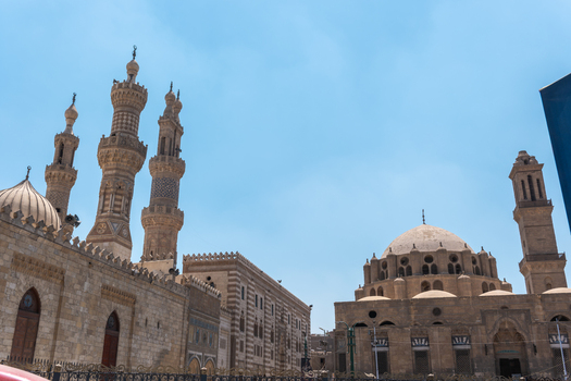 View of Al Azhar and Abu Al Dahab Mosques under a clear blue sky in El Darb El Ahmar Cairo Governorate Egypt. View of Al Azhar and Abu Al Dahab Mosques under a clear blue sky in El Darb El Ahmar Cairo Governorate Egypt.