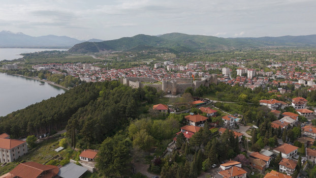 Aerial view of Samuel s Fortress overlooking the city of Ohrid Lake Ohrid and the surrounding mountains under a cloudy sky in Ohrid Municipality of Ohrid North Macedonia. Aerial view of Samuel s Fortress overlooking the city of Ohrid Lake Ohrid and the surrounding mountains under a cloudy sky in Ohrid Municipality of Ohrid North Macedonia.