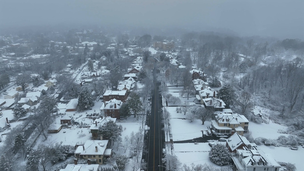 Aerial view of Rivermont Avenue featuring historic houses and snow covered trees lining the quiet street in Lynchburg Virginia United States.