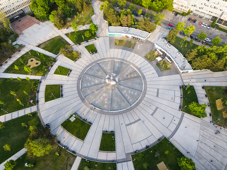 Aerial view of the circular fountain at Freedom Square surrounded by green lawns and paved walkways in Bratislava I Bratislavsky kraj Slovakia. Aerial view of the circular fountain at Freedom Square surrounded by green lawns and paved walkways in Bratislava I Bratislavsky kraj Slovakia.
