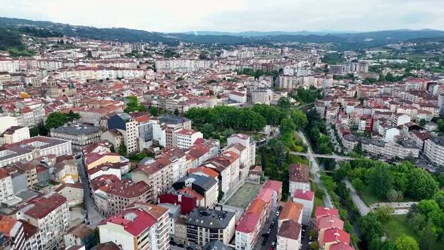Aerial view of the urban landscape and historic rooftops of Ourense Spain. Aerial view of the urban landscape and historic rooftops of Ourense Spain.