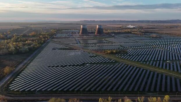Aerial view of solar park with towers Italy.