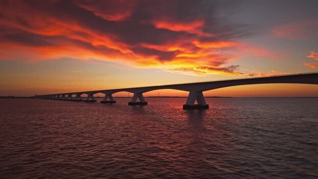 Aerial view of Zeeland Bridge at sunset Netherlands.