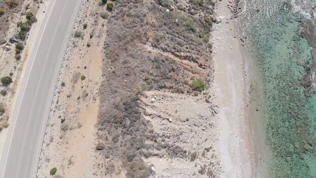 Aerial view of coastal road and cliffs in Northern Cyprus.