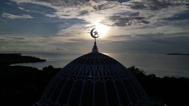 Aerial view of Masjid Raya Nur Ilahi dome at sunset Indonesia. Aerial view of Masjid Raya Nur Ilahi dome at sunset Indonesia.
