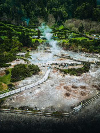 Aerial view of steaming earth and vibrant greenery create a surreal landscape at Furnas Azores Portugal. Aerial view of steaming earth and vibrant greenery create a surreal landscape at Furnas Azores Portugal.
