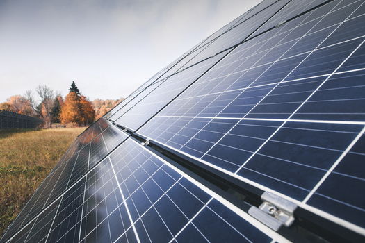 View of solar panels installed in a field with autumn foliage in Otepaa Valga County Estonia. View of solar panels installed in a field with autumn foliage in Otepaa Valga County Estonia.