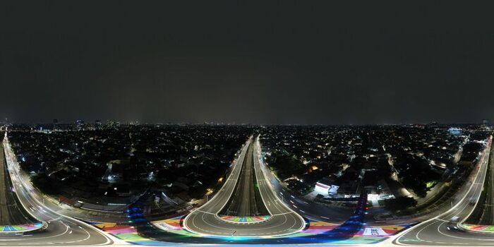 Aerial view of the illuminated Flyover Tapal Kuda Jakarta at night with colorful road markings and light trails from traffic in Pasar Minggu Daerah Khusus Ibukota Indonesia. Aerial view of the illuminated Flyover Tapal Kuda Jakarta at night with colorful road markings and light trails from traffic in Pasar Minggu Daerah Khusus Ibukota Indonesia.