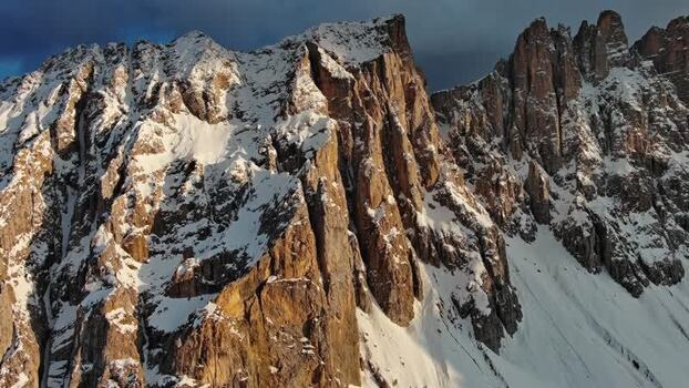 Aerial view of Dolomite Mountains peaks in Canazei Italy.
