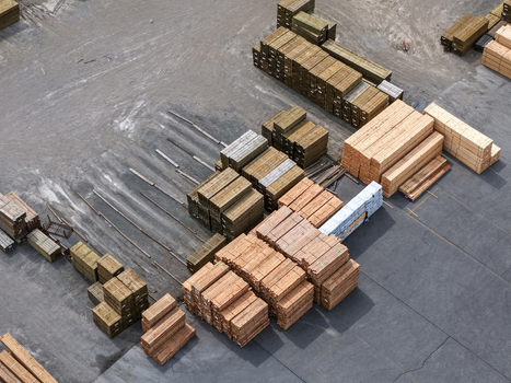 Aerial view of stacks of timber and lumber stored in an industrial yard in Melbourne VIC Australia.