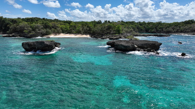 Aerial view of the turquoise waters and rocky islets near La Casita de Playa in Rio San Juan Maria Trinidad Sanchez Dominican Republic.