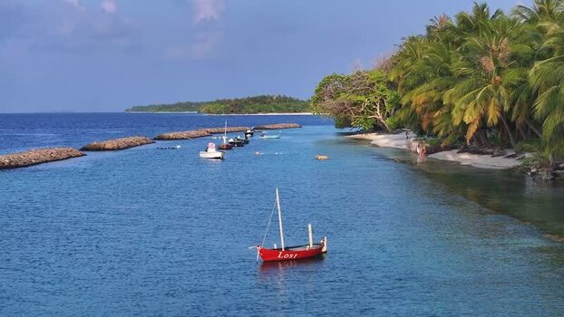 Aerial view of traditional boats anchored in a tropical lagoon Maldives. Aerial view of traditional boats anchored in a tropical lagoon Maldives.